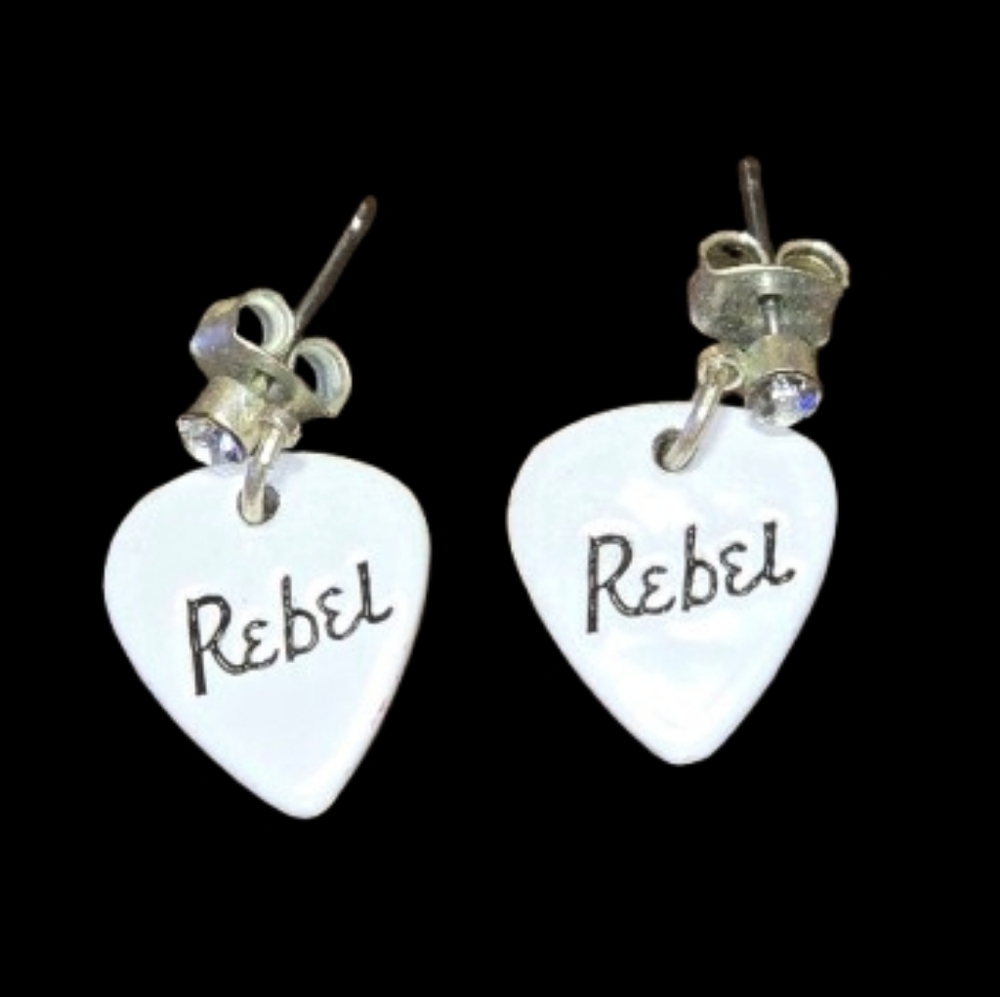 Recovered guitar pick earring with the word "Rebel" on it. . 20